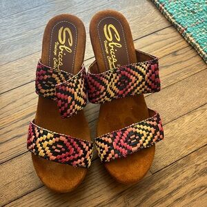 Brand new, never worn wedges. The heel is approximately 4 1/2-5” high.